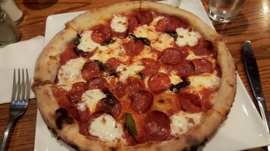 Basta Pizzeria Ristorante signature dishes Lobster Pizza, Burrata Caprese, Margarita Pizza, Nutella Creme Brulee.